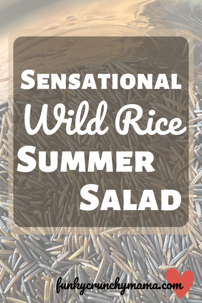 Pin for later! Image includes article title "Sensational Wild Rice Summer Salad" and an image of the salad, which includes walnuts, feta, and carrots.