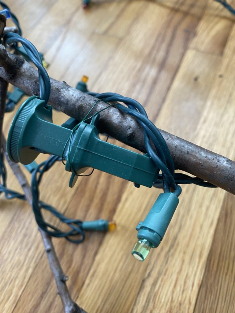 Image shows an electrical cord connection wired to the holiday branch.