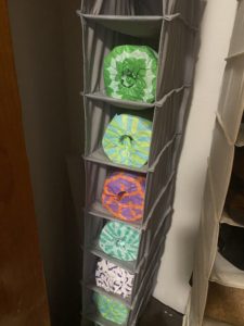 Paper towel storage solution! Place a roll in each slot of closet bar hanging shoe rack. 
